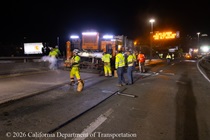 Caltrans crew prepares new road surface on Eastbound Interstate 80 in San Francisco on the night of April 17, 2026.