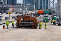 Caltrans crew uses heavy equipment to resurface the roadway on eastbound Interstate 80 in San Francisco on April 19, 2026.