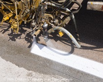 A machine sprays paint for new lines on the roadway of eastbound I-80 in San Francicso on April 19, 2026.