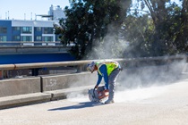 Caltrans crew using a saw finishing up the newly completed polyester overlay on the WB I-80 Bayshore Freeway on October 24, 2026. The purpose of this closure is to perform the polyester overlay of the Bayshore viaduct between 4th street and the I-80/US-101 interchange.