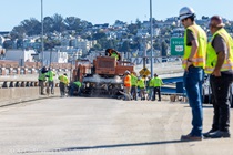 Caltrans crew with heavy equipment applying the polyester overlay on the WB I-80 Bayshore Freeway on October 24, 2026. The purpose of this closure is to perform the polyester overlay of the Bayshore viaduct between 4th street and the I-80/US-101 interchange.