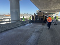 Caltrans crew using heavy equipment preparing I-280/US 101 Interchange for work that  involves installing a polyester concrete deck overlay to improve long‑term pavement durability and ride quality as part of the  I-280 Rehabilitation and Pedestrian Overcrossing Project on October 3, 2026.