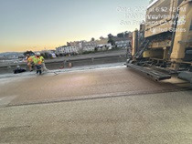 Caltrans crew using heavy equipment to place new polyester concrete as part of the I-280 Rehabilitation and Pedestrian Overcrossing Project that involves installing a polyester concrete deck overlay to improve long‑term pavement durability and ride quality on Friday, October 4, 2026.