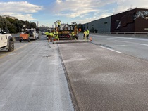 Caltrans crew using heavy equipment to place new polyester concrete as part of the I-280 Rehabilitation and Pedestrian Overcrossing Project that involves installing a polyester concrete deck overlay to improve long‑term pavement durability and ride quality on Friday, October 4, 2026.