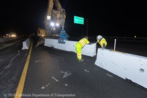 Caltrans crew members use heavy equipment to place temporary barriers as part of the US 101 Hospital Curve Rehabilitation Project on March 13, 2026.