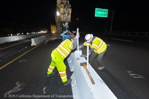 Caltrans crew members install temporary barriers as part of the US 101 Hospital Curve Rehabilitation Project on March 13, 2026.