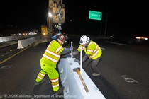 Caltrans crew members install temporary barriers as part of the US 101 Hospital Curve Rehabilitation Project on March 13, 2026.
