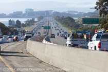 Traffic flows on US 101 between Candlestick Point and Silver Avenue in San Francisco as Caltrans constructs a new median barrier.