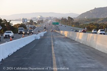 New concrete median on US 101 in San Francisco. Temporary barriers separate traffic from the new median construction.