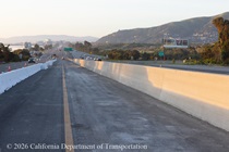 New concrete median on US 101 in San Francisco (right). A temporary barrier (left) separates traffic from the construction area.