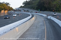 Temporary barriers separate traffic from the new median on US 101 in San Francisco.