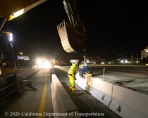 Caltrans uses heavy equipment removing temporary median barrier to prepare the site for the construction of a new median barrier as part of the US 101 Hospital Curve Rehabilitation Project on March 27, 2026.