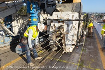 Caltrans crew using slipform paver for the construction of a new median barrier as part of the US 101 Hospital Curve Rehabilitation Project on March 28, 2026.