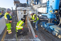 Caltrans crew using slipform paver for the construction of a new median barrier as part of the US 101 Hospital Curve Rehabilitation Project on March 28, 2026.
