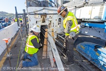 Caltrans crew using slipform paver for the construction of a new median barrier as part of the US 101 Hospital Curve Rehabilitation Project on March 28, 2026.