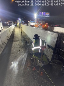 Caltrans crew member performs finishing work on the fresh concrete for the new median barrier as part of the US 101 Hospital Curve Rehabilitation Project on March 28, 2026.