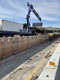 Caltrans using heavy equipment building the new median barrier as part of the US 101 Hospital Curve Rehabilitation Project on March 29, 2026.