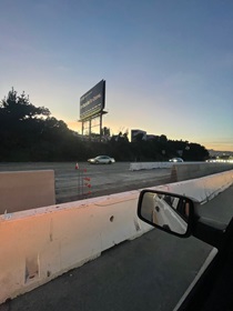 Cars traveling on U.S. 101 passing by a nearly completed portion of the new median barrier as part of the US 101 Hospital Curve Rehabilitation Project on March 29, 2026.