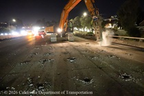 Caltrans using an excavator with a hydraulic breaker to demolish old concrete pavement on northbound U.S. 101 Bayshore Freeway (Hospital Curve) in San Francisco on September 4, 2026.