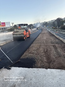 Caltrans using a road roller on new asphalt as work continues to replace concrete pavement panels on northbound U.S. 101 Bayshore Freeway (Hospital Curve) in San Francisco on September 5, 2026.