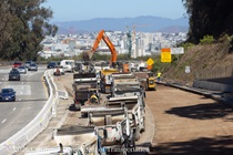 Caltrans trucks lined up next to removed concrete pavement on northbound U.S. 101 Bayshore Freeway (Hospital Curve) in San Francisco on September 5, 2026.