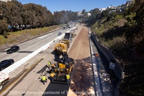 Caltrans crews laying new asphalt, preparing the surface as work continues to replace concrete pavement panels on northbound U.S. 101 Bayshore Freeway (Hospital Curve) in San Francisco on September 5, 2026.