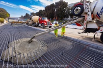 Caltrans crews using heavy equipment to pour new concrete pavement on northbound U.S. 101 Bayshore Freeway (Hospital Curve) in San Francisco on September 5, 2026.