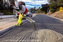 Caltrans crews using heavy equipment to pour new concrete pavement on northbound U.S. 101 Bayshore Freeway (Hospital Curve) in San Francisco on September 5, 2026.