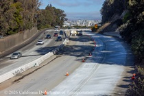 Cars traveling on southbound US-101 as Caltrans workers are finishing the newly poured concrete pavement on northbound U.S. 101 Bayshore Freeway (Hospital Curve) in San Francisco on September 6, 2026.