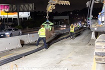Crews work along U.S. 101 near Hospital Curve during a full highway closure for road rehabilitation in the city of San Francisco on the night of September 18, 2026.