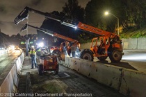 Crews work along U.S. 101 near Hospital Curve during a full highway closure for road rehabilitation in the city of San Francisco on the night of September 18, 2026.
