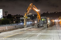 Crews work along U.S. 101 near Hospital Curve during a full highway closure for road rehabilitation in the city of San Francisco on the night of September 18, 2026.