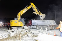 Crews work along U.S. 101 near Hospital Curve during a full highway closure for road rehabilitation in the city of San Francisco on the night of September 18, 2026.