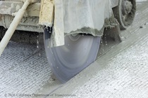 A Caltrans crew uses machinery to prepare the new concrete on northbound US-101 near Hospital Curve in San Francisco on Sunday, September 20, 2026.
