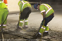 Crew members work on the removal of the old roadway material on southbound US-101 during the night of October 16, 2026.