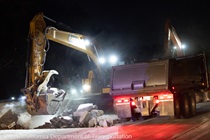 Heavy equipment is used to remove the old roadway material on southbound US-101 during the night of October 16, 2026.