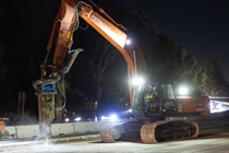 Heavy equipment is used to remove the old roadway material on southbound US-101 during the night of October 16, 2026.