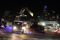 Heavy equipment is used to remove the old roadway material on southbound US-101 during the night of October 16, 2026.