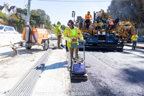 A crew installs new roadway material as part of the roadway rehabilitation project on southbound US-101 near Hospital Curve on Saturday, October 17, 2026.