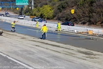 A crew smooths concrete during the roadway rehabilitation project on southbound US-101 near Vermont Street on Saturday, October 17, 2026.