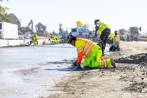 A crew smooths concrete during the roadway rehabilitation project on southbound US-101 near Hospital Curve on Saturday, October 17, 2026.