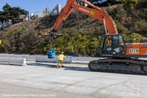 Caltrans uses heavy equipment to move temporary barriers during the roadway rehabilitation project on southbound US-101 near Hospital Curve on Sunday, October 18, 2026.