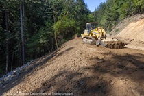 SR-84 storm damage repair of landslide (slipout) at PM 17.9 near Woodside, rock slope protection installation completed, earthwork, meeting between contractor and Caltrans, Fred Broosheri.