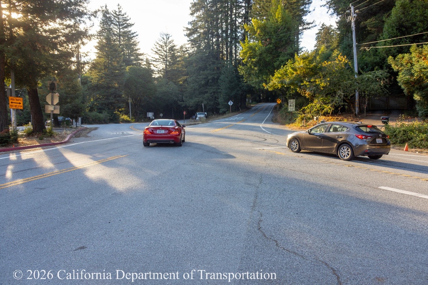 Cars at the intersection of State Route 35 (Skyline Boulevard) and State Route 84 (La Honda Road), commonly known as the Four Corners Intersection.