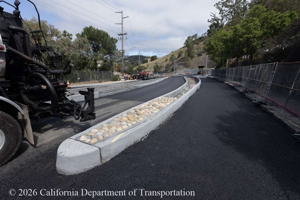New reconstruction of curb ramps and sidewalks as part of the roundabout project at Manuel T. Freitas Parkway/US-101 interchange.