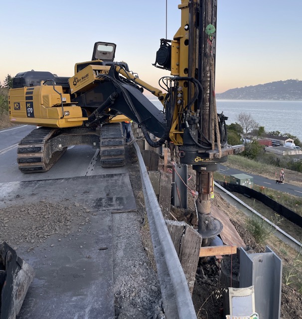 Caltrans using heavy equipment preparing for construction of new retaining wall on State Route 131 (Tiburon Boulevard) Retaining Wall Project at Stewart Drive.