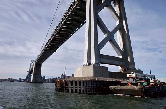 Bay Bridge with an adjacent barge repairing the bridge fender after a ship strike