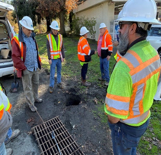 Caltrans engineers discuss plans to address a damaged culvert near Calistoga, California.