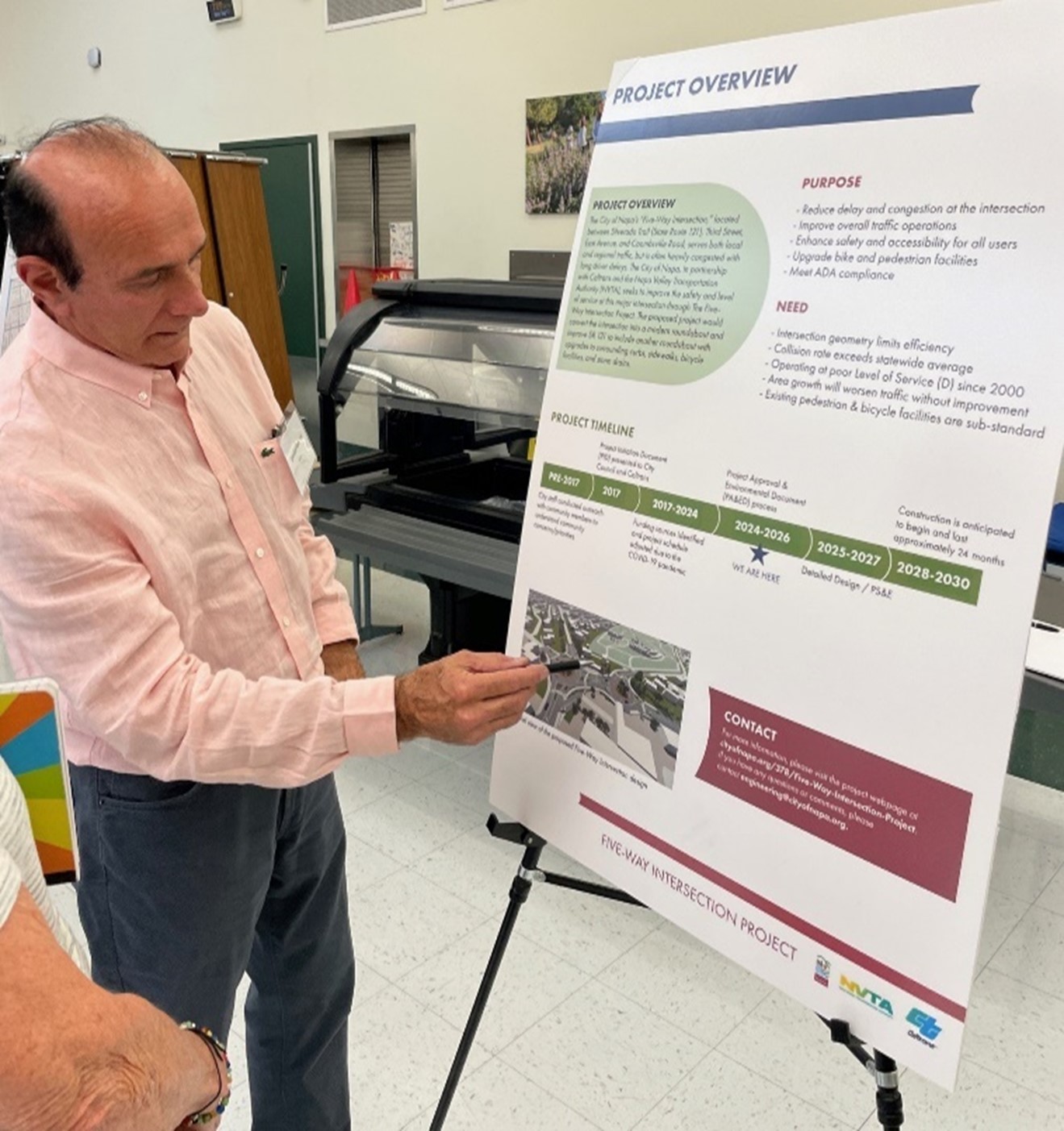 Caltrans showing attendants a billboard of the project overview at a public meeting for the Five-Way Intersections Project in the City of Napa on SR-121 that was held on September 17 at Alta Heights Elementary School in Napa. 