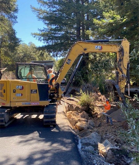 Caltrans using heavy equipment for erosion control work on SR-121/Monticello Road in Napa County.